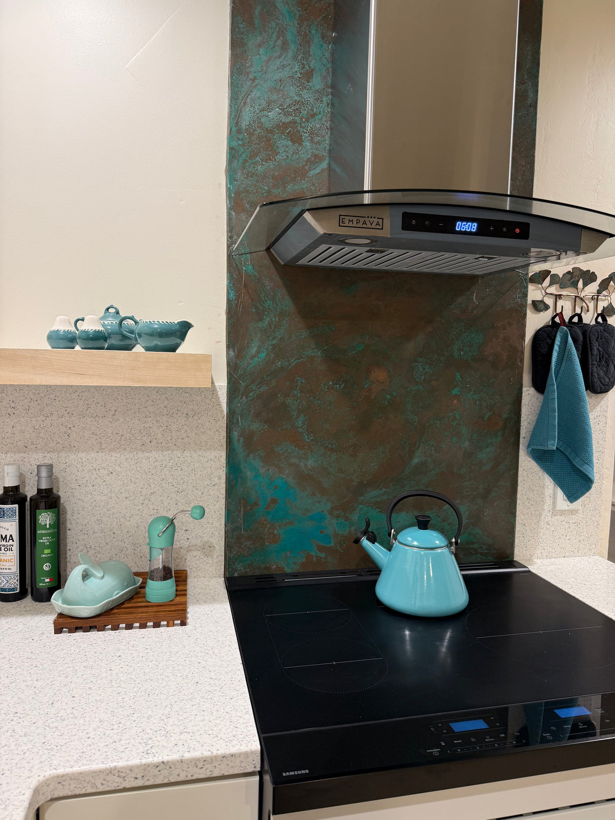 Stove backsplash covered in Tiffany Green Swirl heavy gauge patina copper