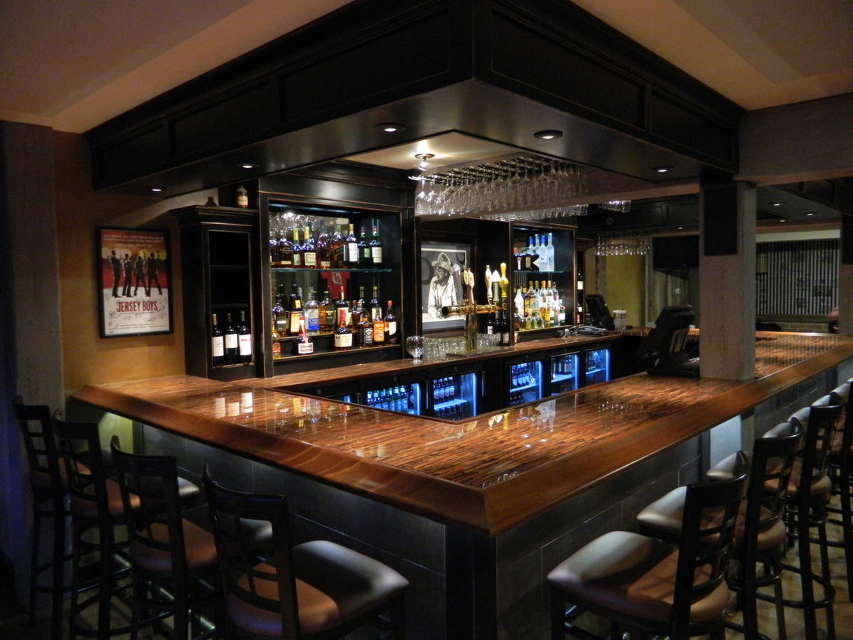 Restaurant bar top covered in Enchantment light gauge patina copper sealed under clear epoxy