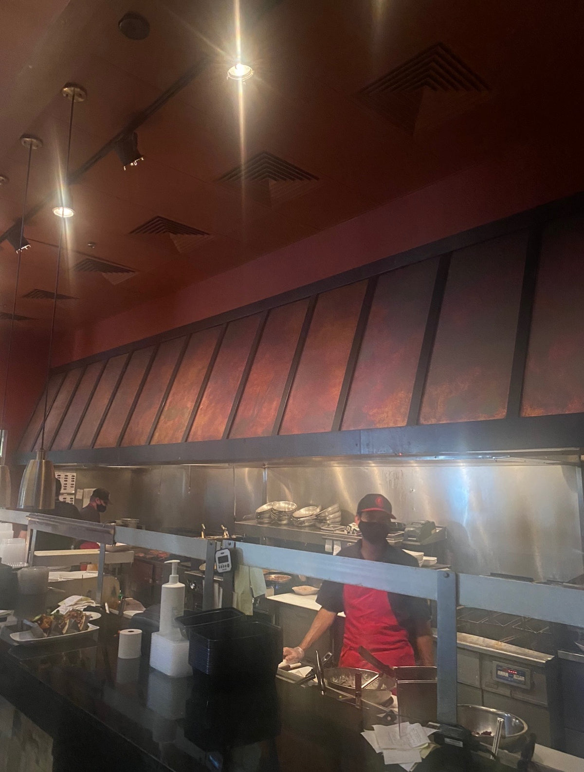 Restaurant range hood covered in Rustic heavy gauge patina copper