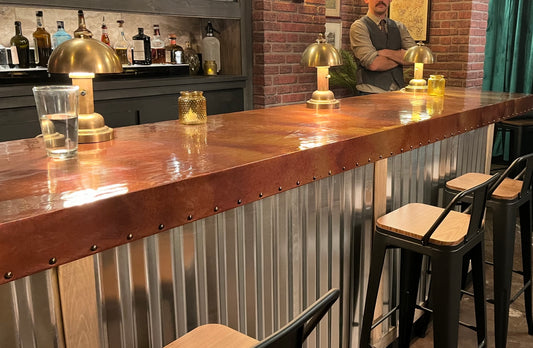 Bar top covered in Antique light gauge patina copper sealed under clear epoxy