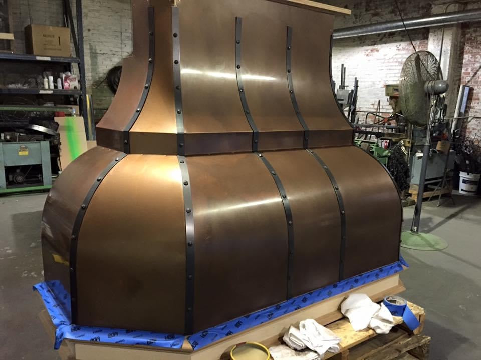 Range hood covered in Antique heavy gauge patina copper