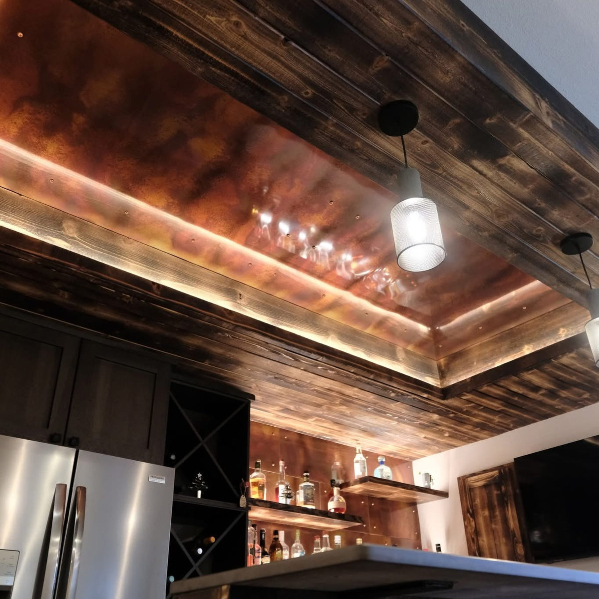 Home bar ceiling and back wall covered in Rustic heavy gauge patina copper