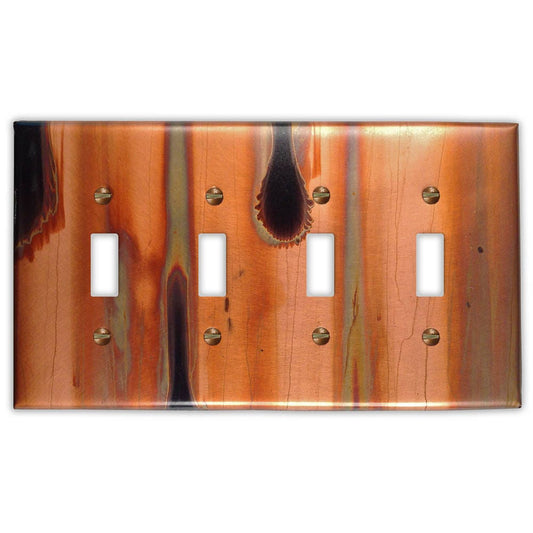 Quadruple Toggle Copper Switch Plate in Stellar