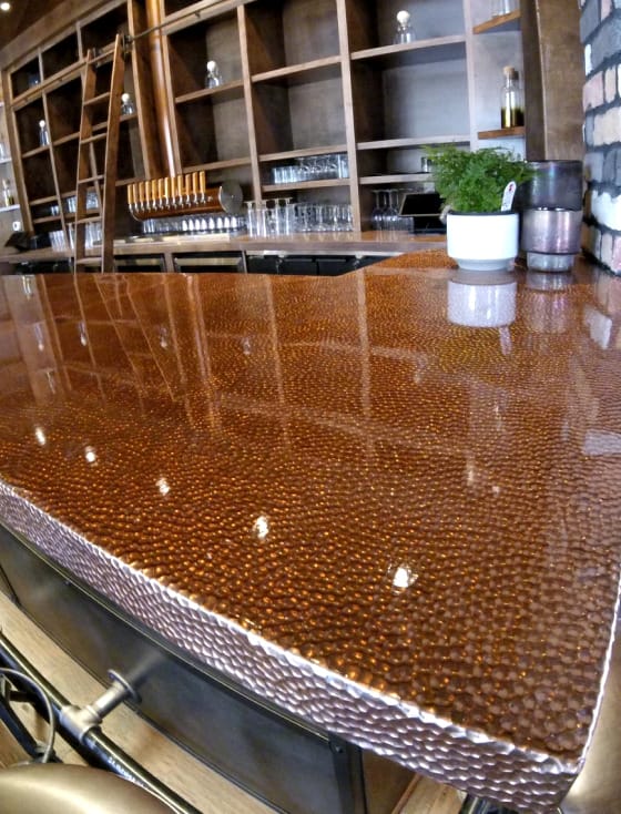 A bar with a copper counter top.